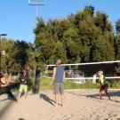 Players playing Beach Volleyball at Rec Pool beach courts.