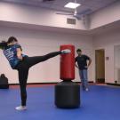 student and instructor in self-defense exercise